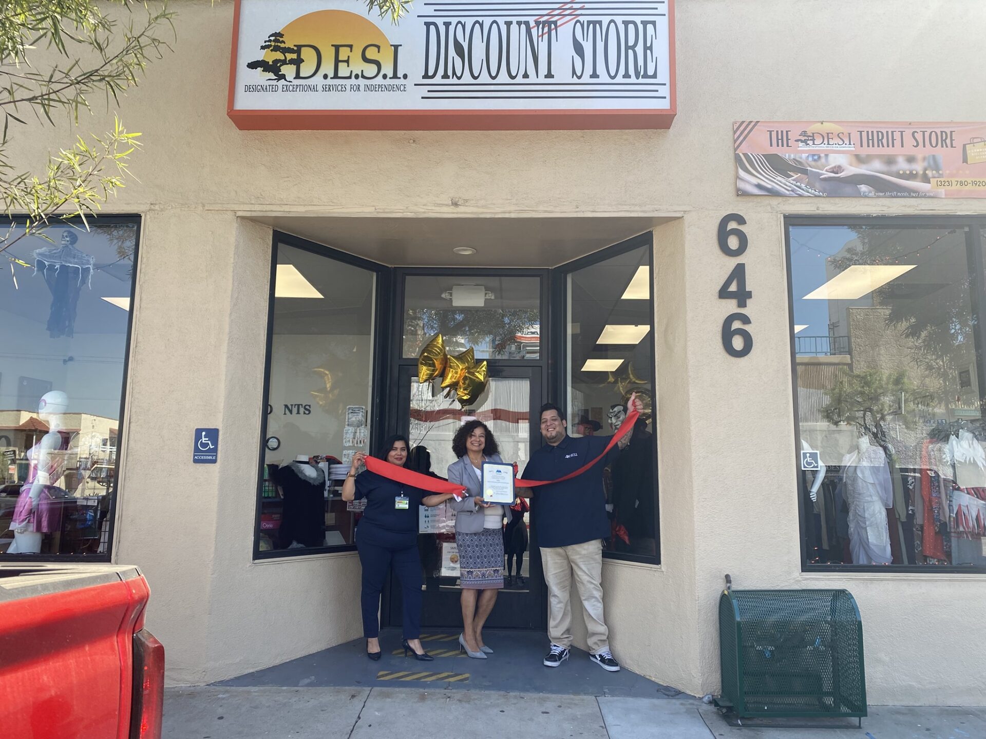 DESI Executive director and staff at re-opening of DESI Shop
